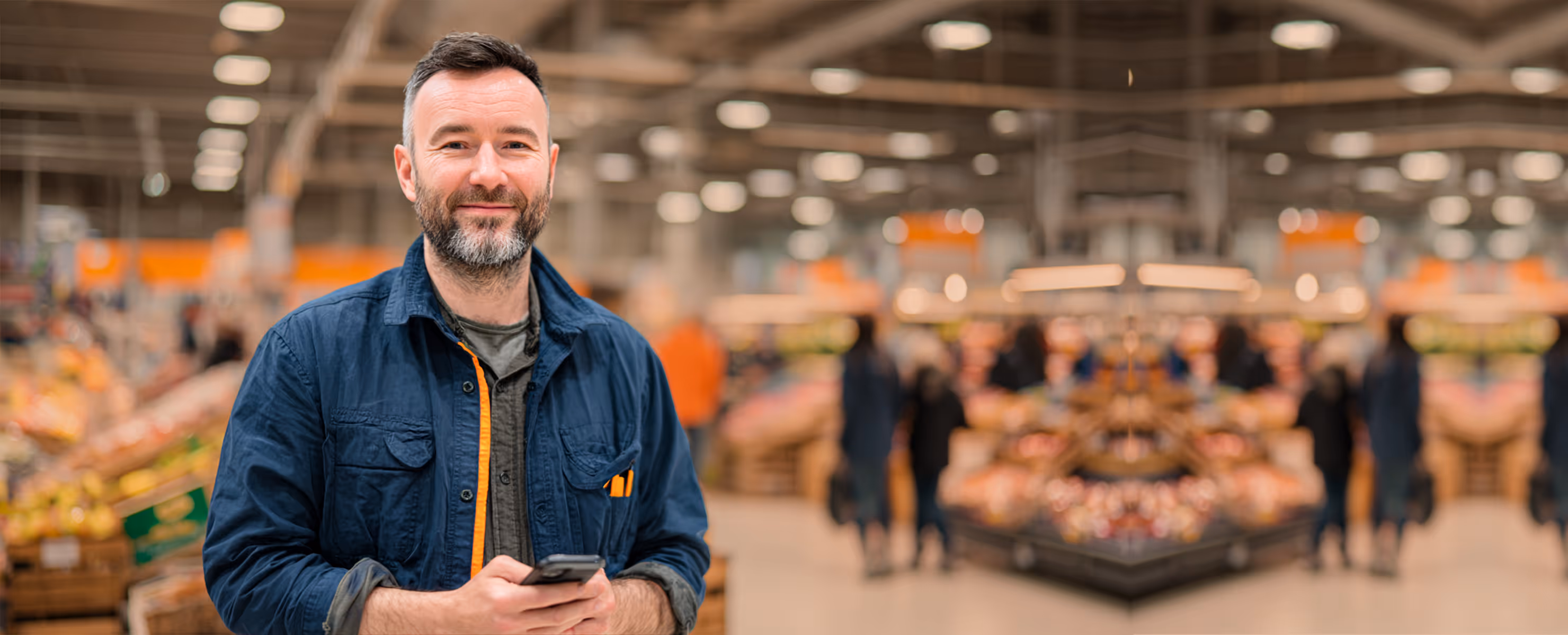 Supermarket manager confirming store standards in retail store audit software